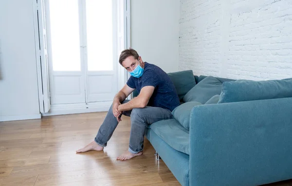 Sad Man Protective Face Mask Home Living Room Couch Feeling — Stock Photo, Image