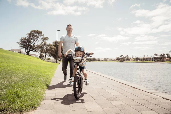 Boy Learning Ride Bicycle His Father Park Lake Father Son — Stock Photo, Image