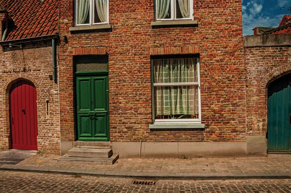 Brick facade of old houses in street of Bruges — Stock Photo, Image