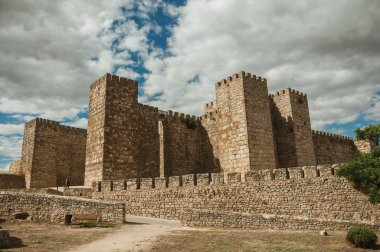 Towers and stone walls facade at the Castle of Trujillo clipart