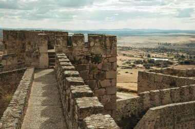 Pathway on top of stone wall at the Castle of Trujillo clipart