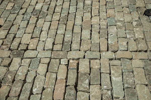 Kamenné dlažební kostky bloky, které jsou na staveništi na písčitém místě — Stock fotografie