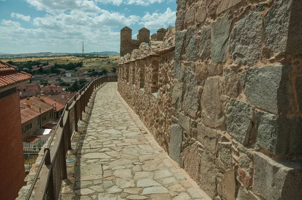 Pathway over old thick wall encircling the town of Avila