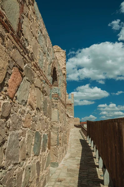 Pathway over old thick wall encircling the town of Avila