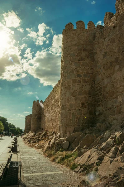 Pedestrian promenade and city wall with quaint tower at Avila