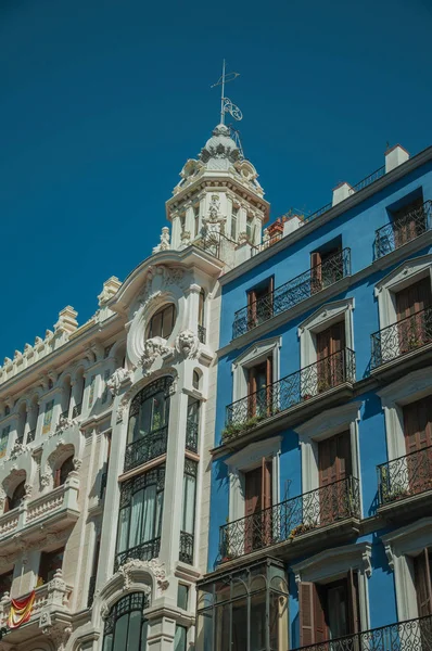 Colorful buildings full of windows and balconies in Madrid