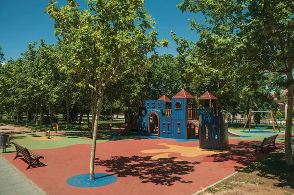 Park full of leafy trees and playground at Merida — Stock Photo, Image