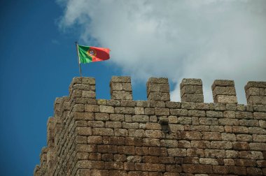 Portuguese flag fluttering on top of tower from Castle clipart