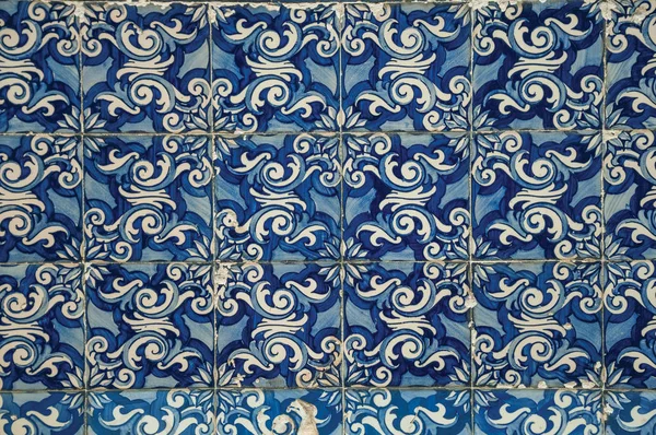 Blue floral pattern hand-painted in baroque style on ceramic tiles