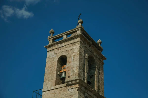 Medieval steeple made of stone with bronze bell — Stock Photo, Image