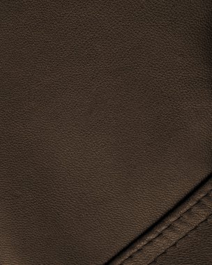 kahverengi deri arka plan bir dikiş ile dekore edilmiştir.