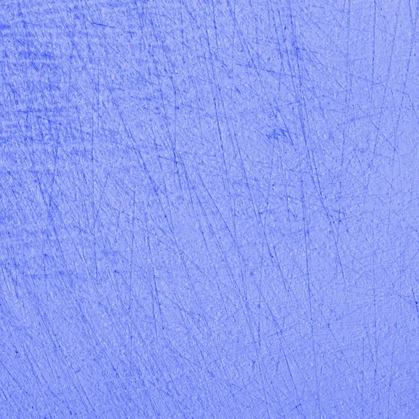 fragment of blue old scratched plastic cutting board as background