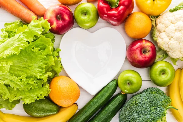 Top View Fresh Fruits Vegetables Empty Heart Shaped Plate Wooden — Stock Photo, Image