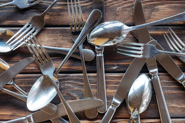 Full Frame Arranged Steel Cutlery Wooden Tabletop — Free Stock Photo