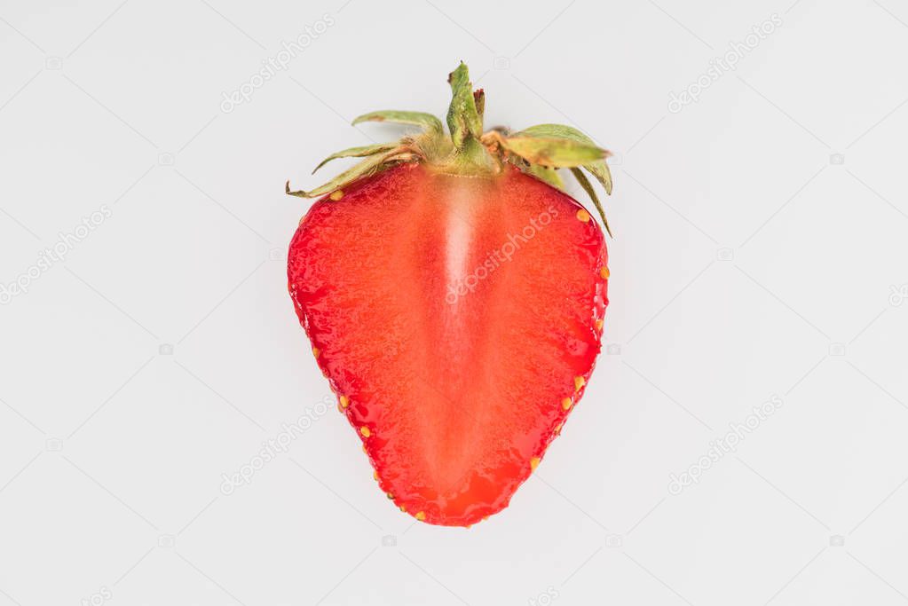 Single cut strawberry isolated on white background
