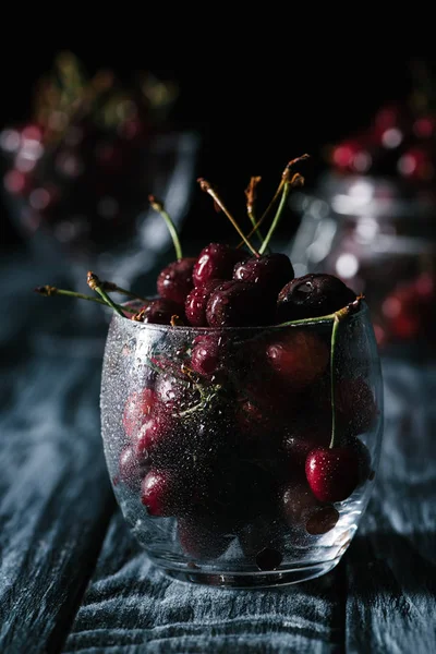 Close View Ripe Organic Cherries Wet Glass Wooden Table — Stock Photo, Image