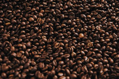 Texture of coffee beans in process of roasting clipart