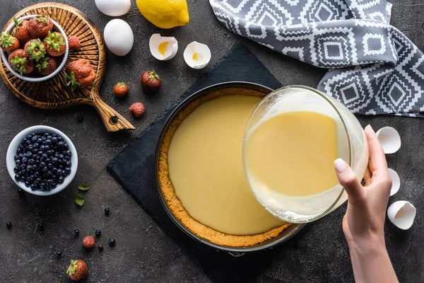 Partial View Woman Pouring Cream Pie Dough Arranged Ingredients Dark — Stock Photo, Image