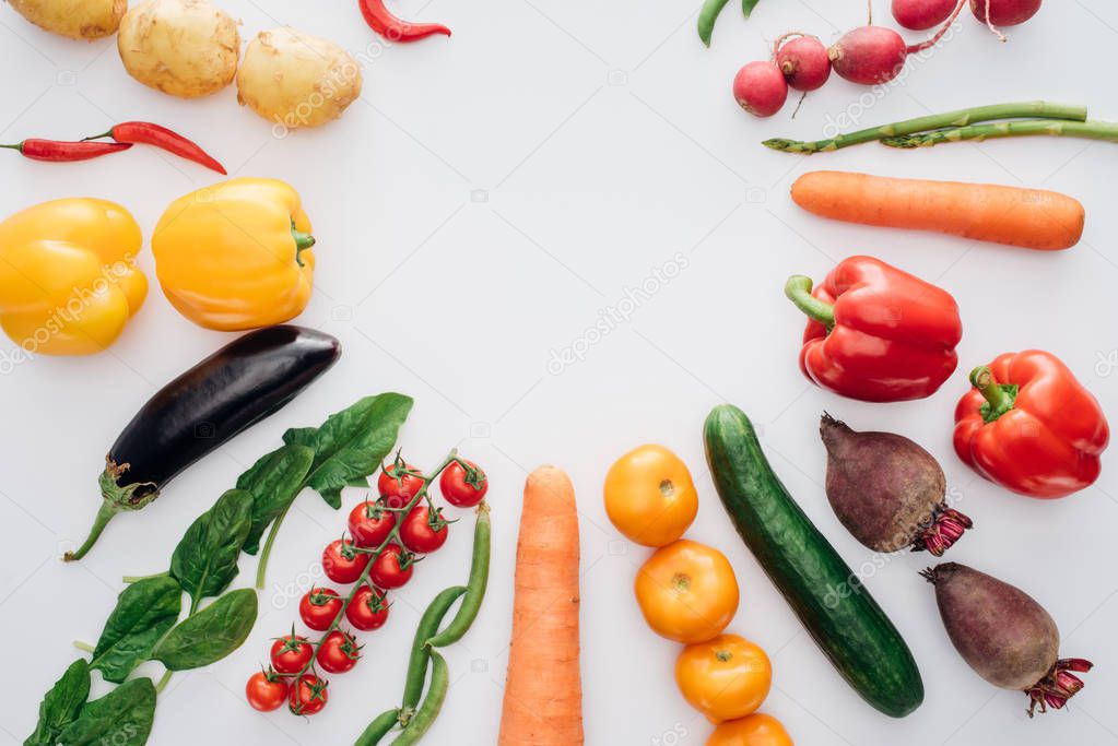 top view of various fresh ripe vegetables isolated on white background