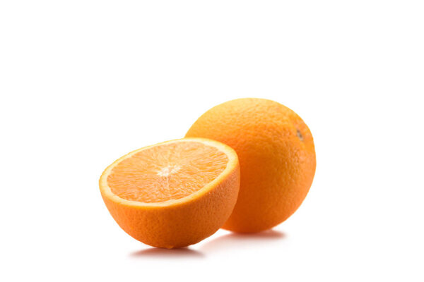 close up view of piece of orange and wholesome fruit isolated on white