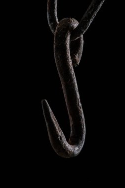  close up view of vintage rusty hook isolated on black clipart