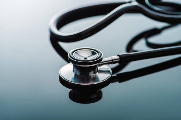 selective focus of stethoscope on glass surface 