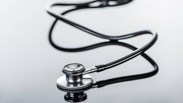 selective focus of stethoscope on glass surface 