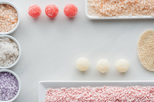 top view of various bath and spa accessories on white