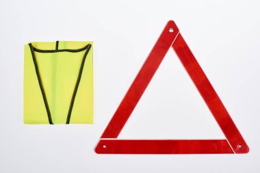 top view of warning triangle and reflective vest isolated on white clipart