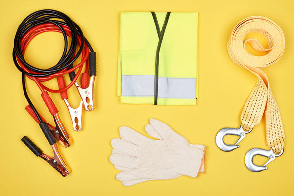 flat lay with arrangement of automotive accessories isolated on yellow