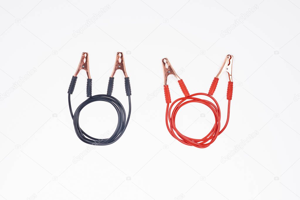 top view of arranged jump start cables isolated on white