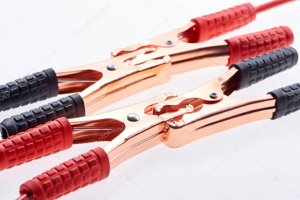 close up view of jump start cables isolated on white