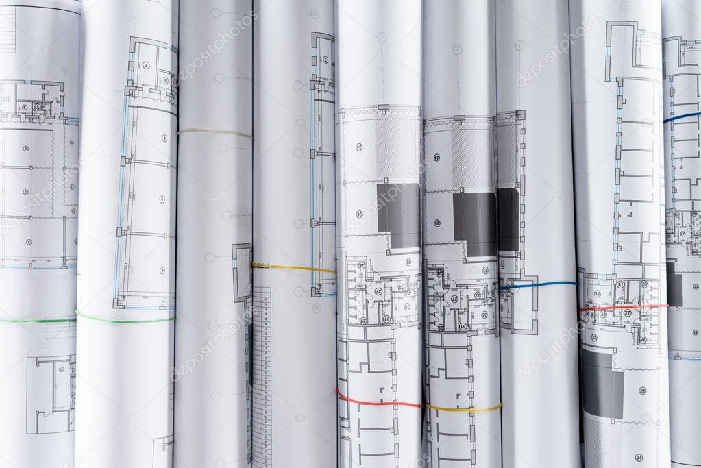 full frame image of arranged architect blueprints placed in row 