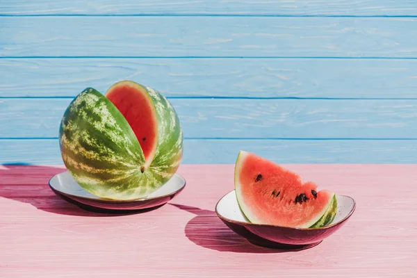 Close View Cut Watermelon Plates Blue Backdrop — Stok Foto