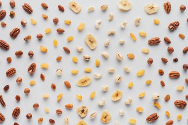 flat lay with mix of dried fruits and nuts isolated on white background clipart