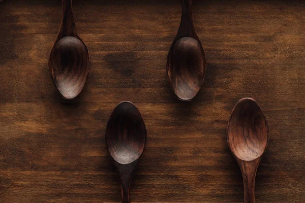 Top View Wooden Spoons Dark Brown Surface — Stock Photo, Image