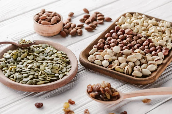 Mixed Nuts Raisins White Wooden Background — Stock Photo, Image