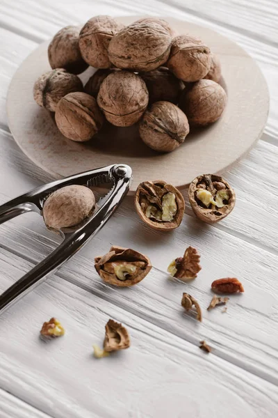 Delicious Walnuts Metal Nutcracker Wooden Table — Stock Photo, Image