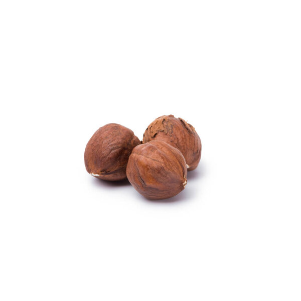 handful of hazelnuts without nutshells isolated on white background