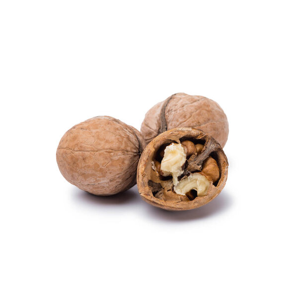 natural walnuts isolated on white background