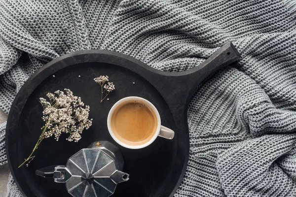 Top view of cup of coffee and moka pot with field flowers on wool knitted drapery — Stock Image Top View Cup Coffee Moka Pot Field Flowers Wool Knitted Royalty Free Stock Photos