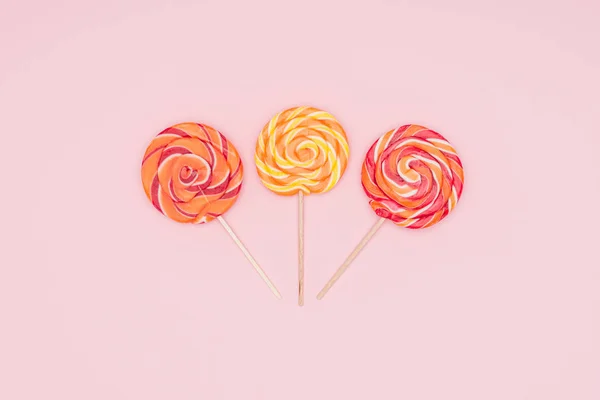 Top View Three Yummy Lollipops Isolated Pink — Stock Photo, Image