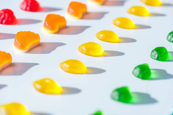 collection of sweet colored jelly candies on white