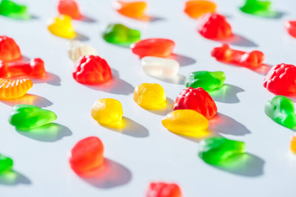 tasty bright jelly candies on white surface