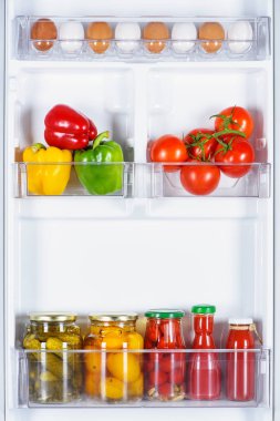 tasty ripe and preserved vegetables in fridge clipart