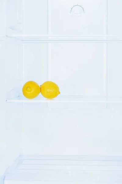 Two Ripe Lemons Shelf Fridge — Free Stock Photo