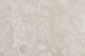 Abstraktní detailní textura světle béžového mramorového kamene