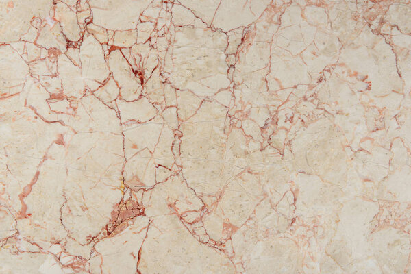 cracked texture of beige marble stone