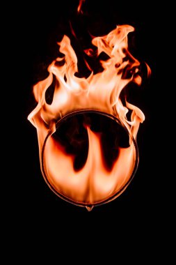 close up view of burning circle figure isolated on black clipart