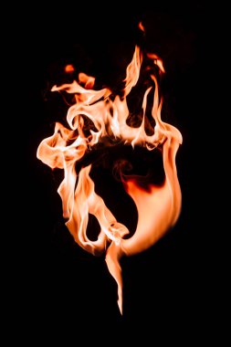 close up view of burning circle figure isolated on black clipart